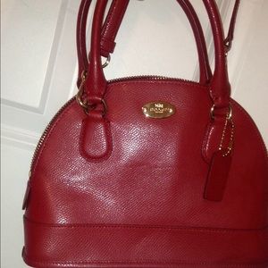 Bright red hand bag with removable cross body.